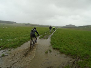 Mike, Stephen and Marc riding through the puddles on Pen y Gwely. 