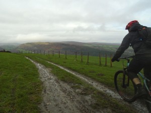 Stephen with a view of Worlds End at the start of the Three Trees descent into the Vale of Llangollen. 