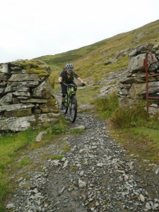 Brian threading the gate on the Bwlch y Rhiwgyr descent.             