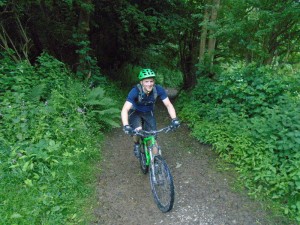 Tom climbing through Crogen Wladys wood.