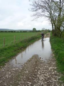 Becky in the puddles of the Starlings Castle bridleway.