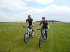 Ian and Jill riding over Pen-y-Gwely. 