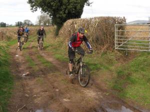 Simon on the muddy double track in the Vale of Clwyd near Ruthin.