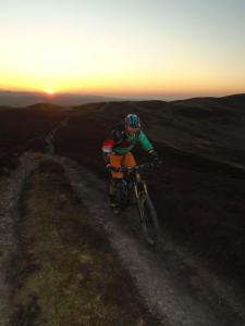 Gareth at sunset on the Moel Dywyll concessional trail along the spine of the Clwydian Range.