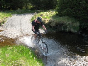Gaz riding through the Afon Llechweth-mawr ford.          