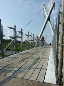 Col (flattyres) crossing the Machynlleth cycle bridge. 
