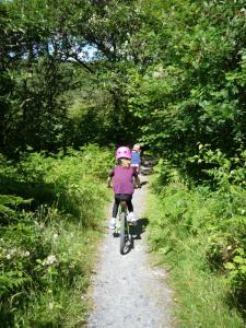 Elisabeth and Anna following the woodland singletrack back to the Trawsfynydd Lake Centre.