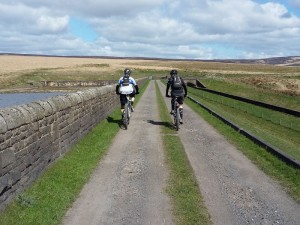 Paul and Laurence crossing the lower Gorple Reservoir.
