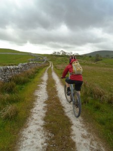 Graham climbing to the B6479 junction on the Pennine Bridleway.