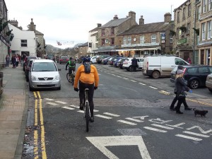 Riding through the centre of Hawes in the Yorkshire Dales.
