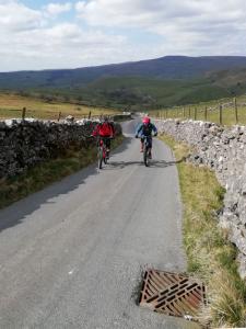 James and Mark on the steep Hawthorns Lane climb from Gordale Scar.